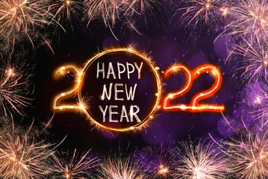 Image of Bright text Happy New 2022 Year made of firework on dark background. Greeting card design