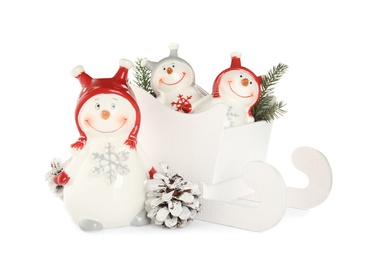 Photo of Christmas composition with decorative snowmen on white background