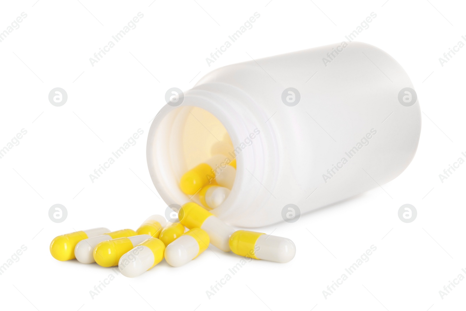 Photo of Scattered antibiotic pills and bottle isolated on white