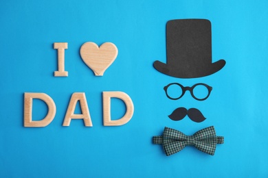 Photo of Flat lay composition with paper decor and bow tie on color background. Happy Father's Day