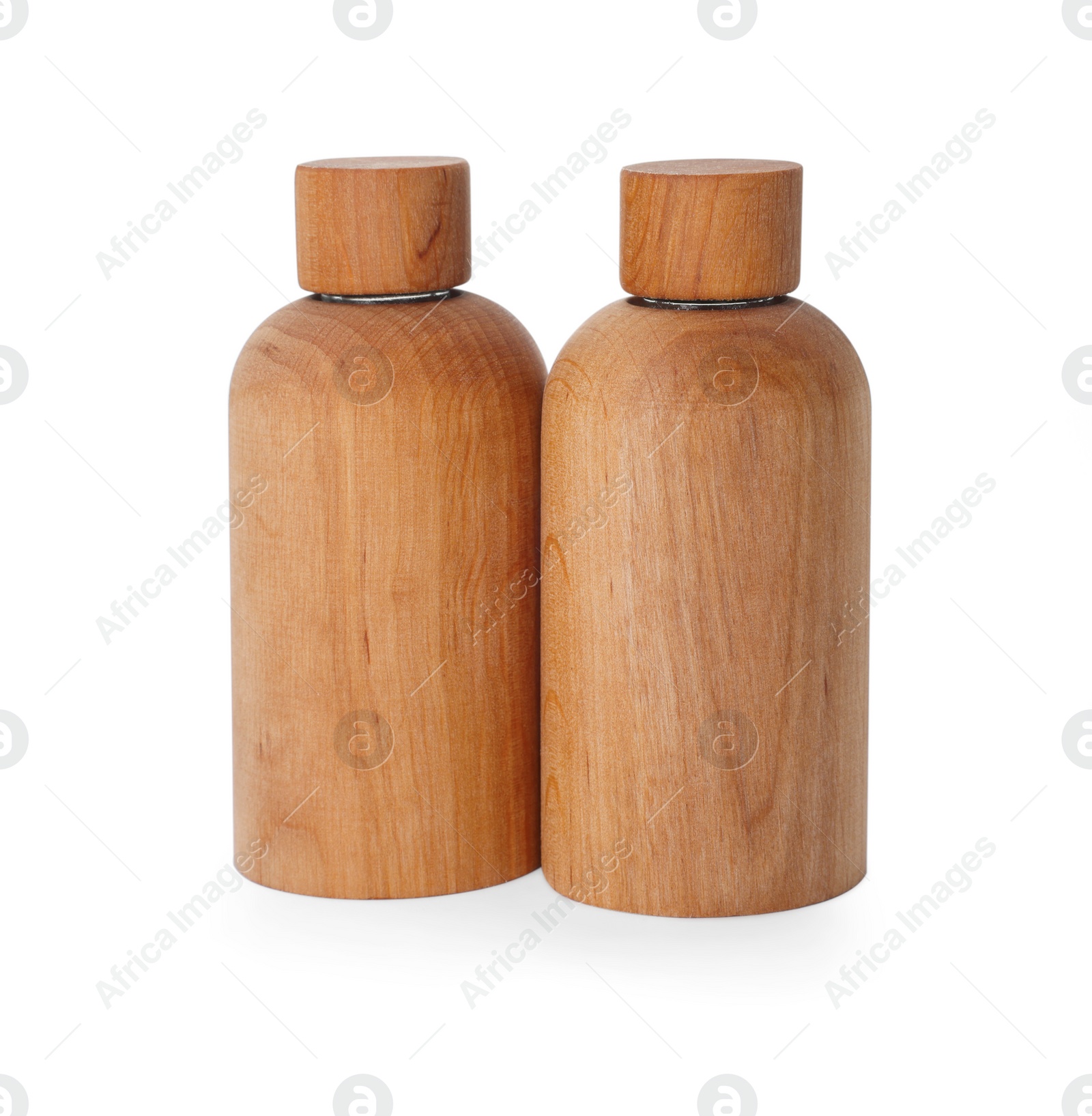 Photo of New stylish wooden bottles isolated on white