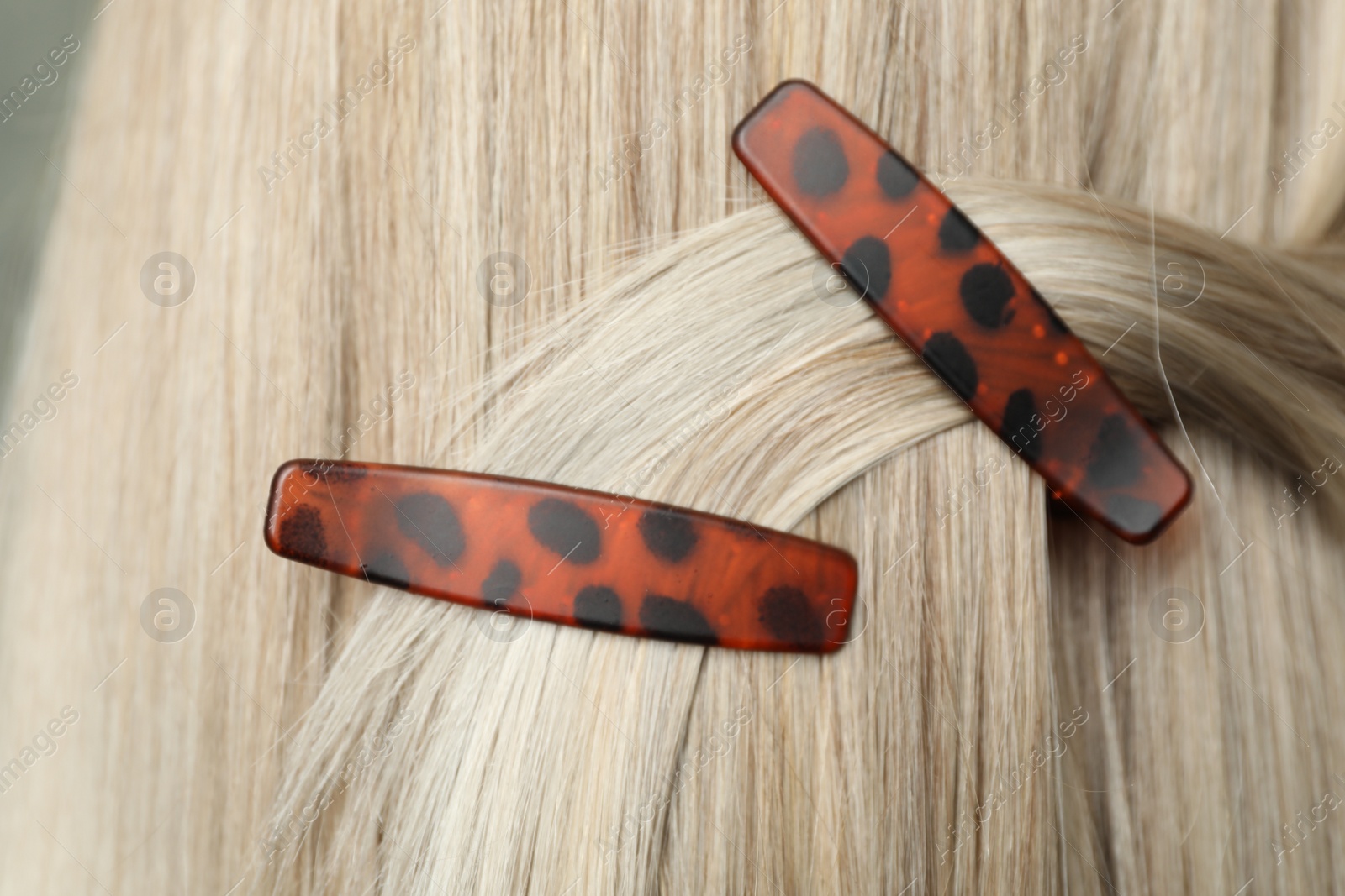 Photo of Woman with beautiful hair clips, closeup view