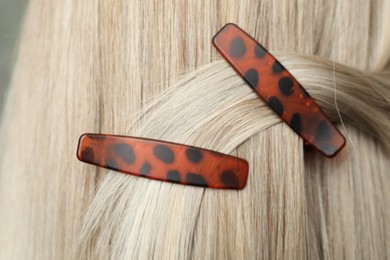 Photo of Woman with beautiful hair clips, closeup view