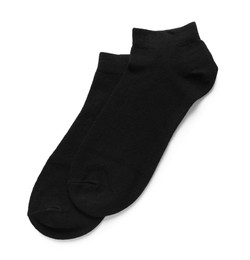 Pair of black socks on white background, top view