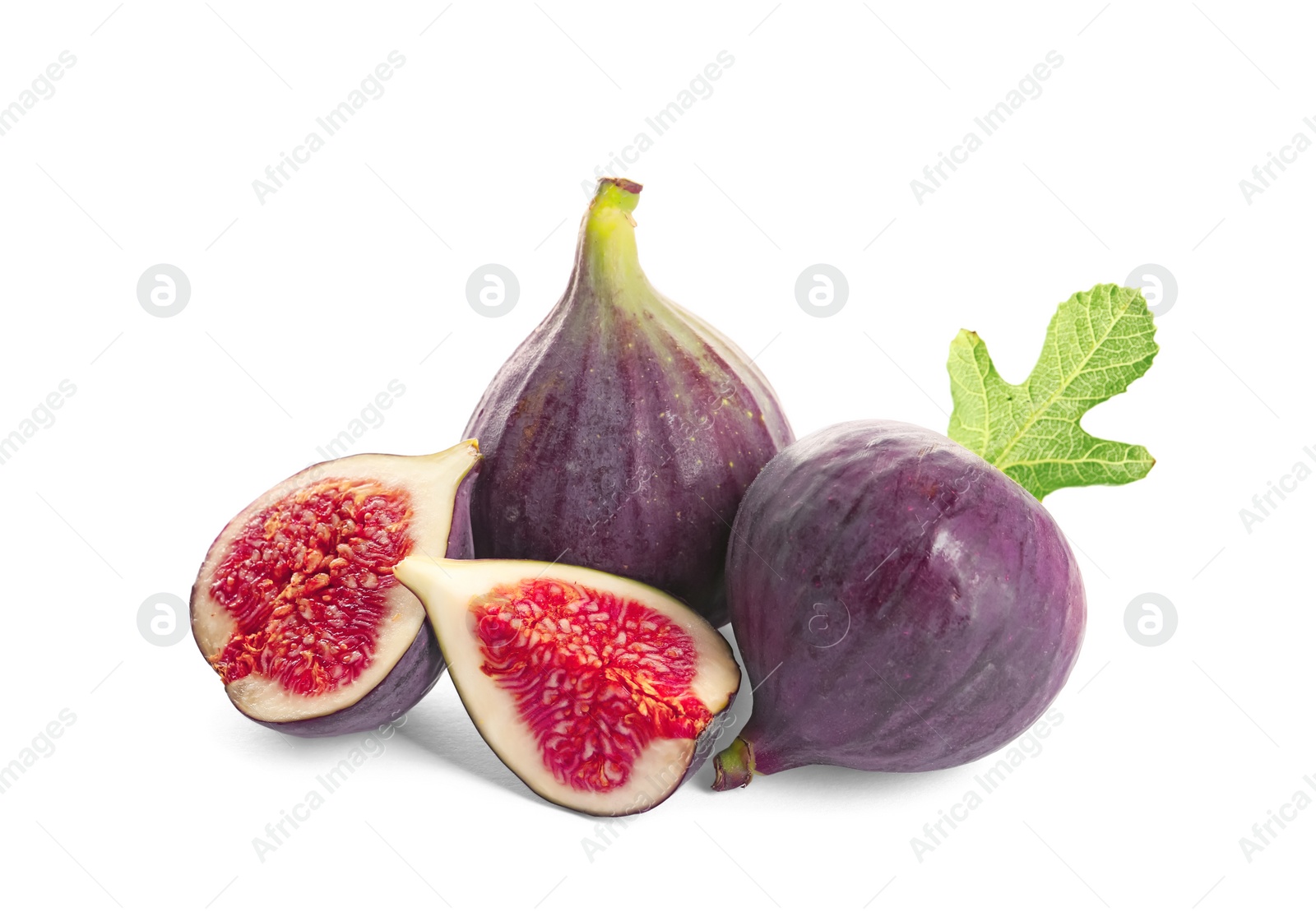 Photo of Whole and cut purple figs on white background