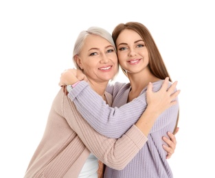 Photo of Portrait of young woman with her mature mother on white background