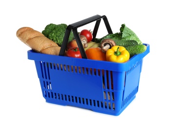 Photo of Shopping basket with grocery products on white background