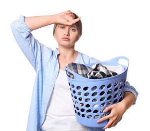 Photo of Tired woman with basket full of laundry on white background