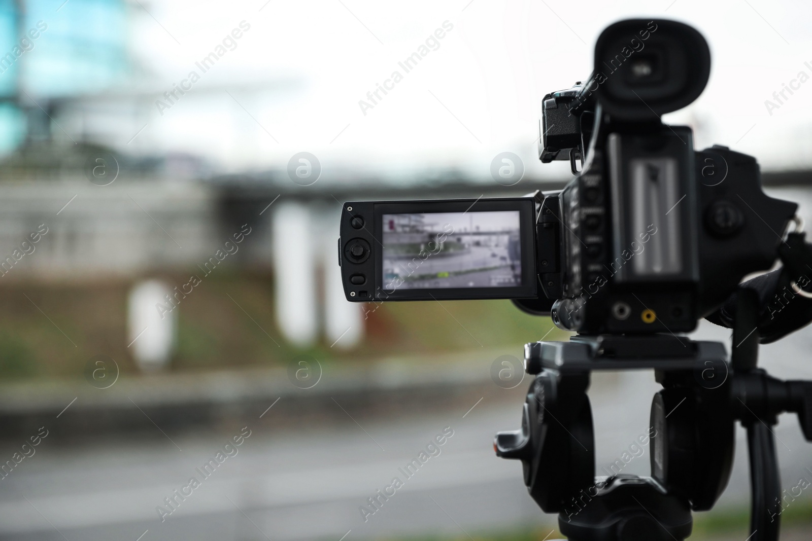 Photo of Professional video camera outdoors. Space for text