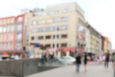 Photo of Blurred view of city street on sunny day