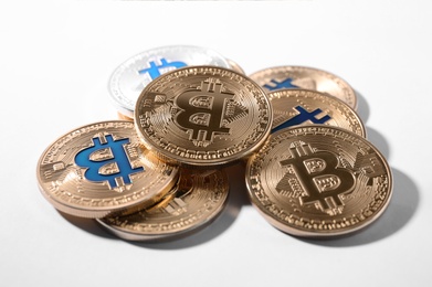 Photo of Golden and silver bitcoins on white background. Digital currency