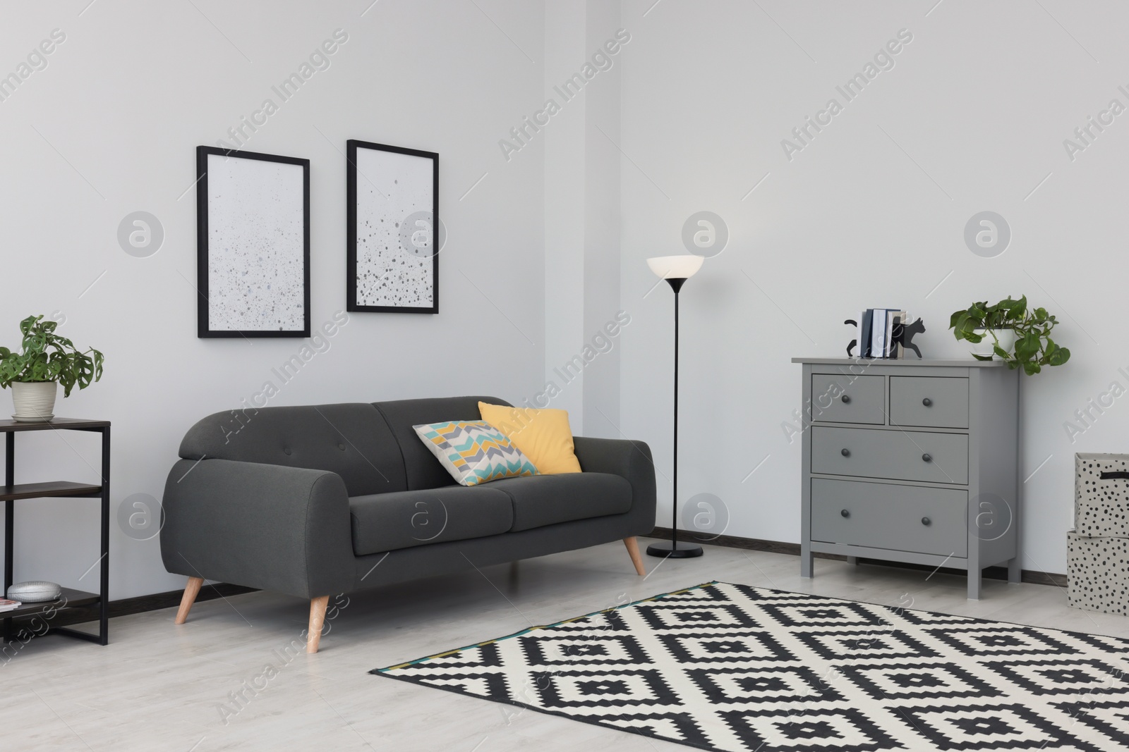 Photo of Beautiful living room interior with stylish grey sofa