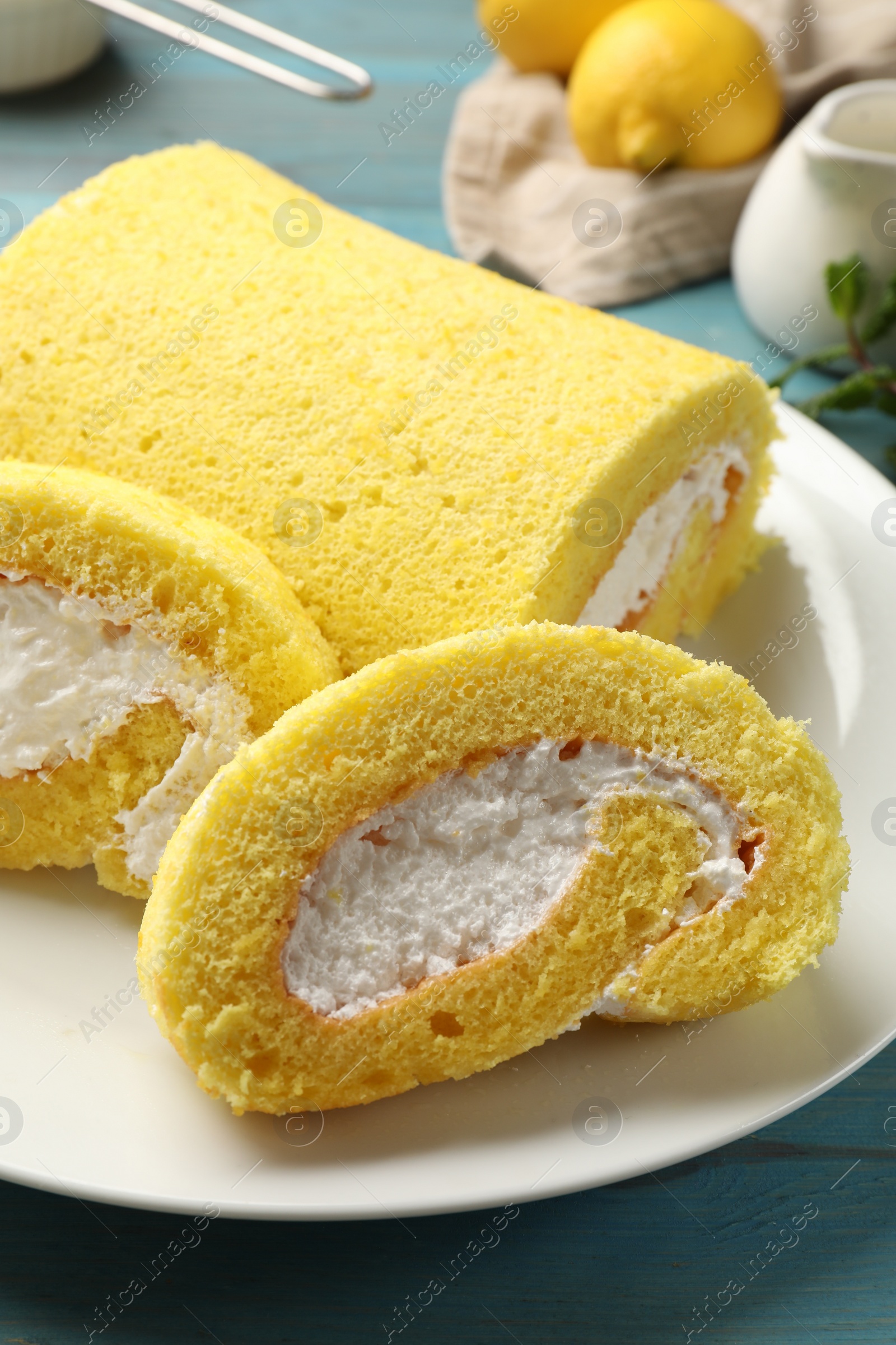 Photo of Pieces of delicious cake roll on table, closeup