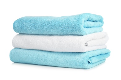 Folded soft terry towels on white background