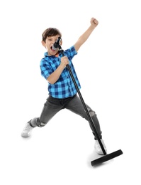 Photo of Cute little boy singing into microphone on white background