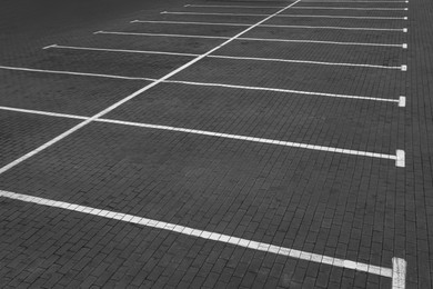 Empty car parking lots with white marking lines outdoors