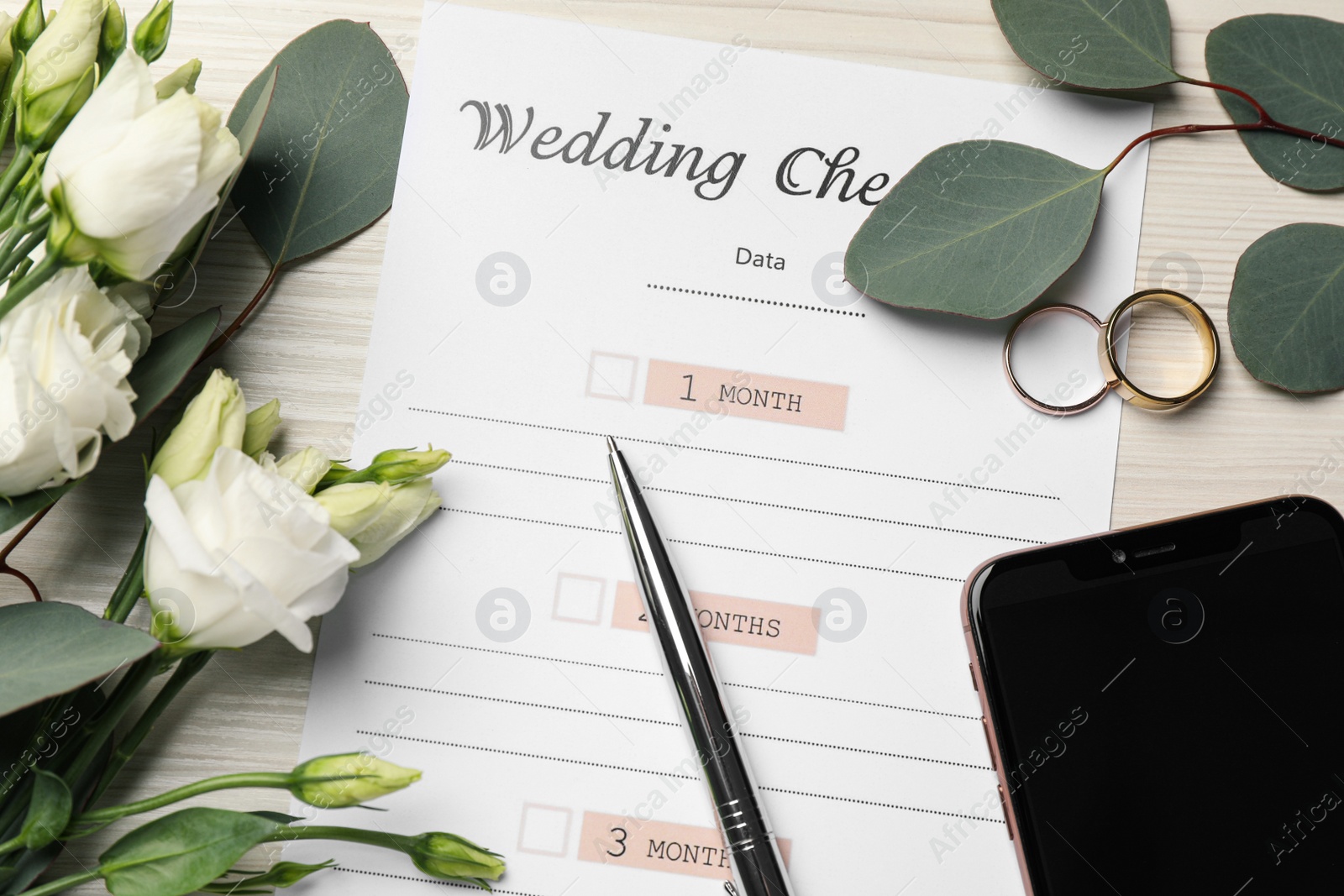 Photo of Flat lay composition with Wedding Checklist on white wooden table