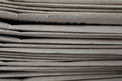 Stack of newspapers as background, closeup. Journalist's work