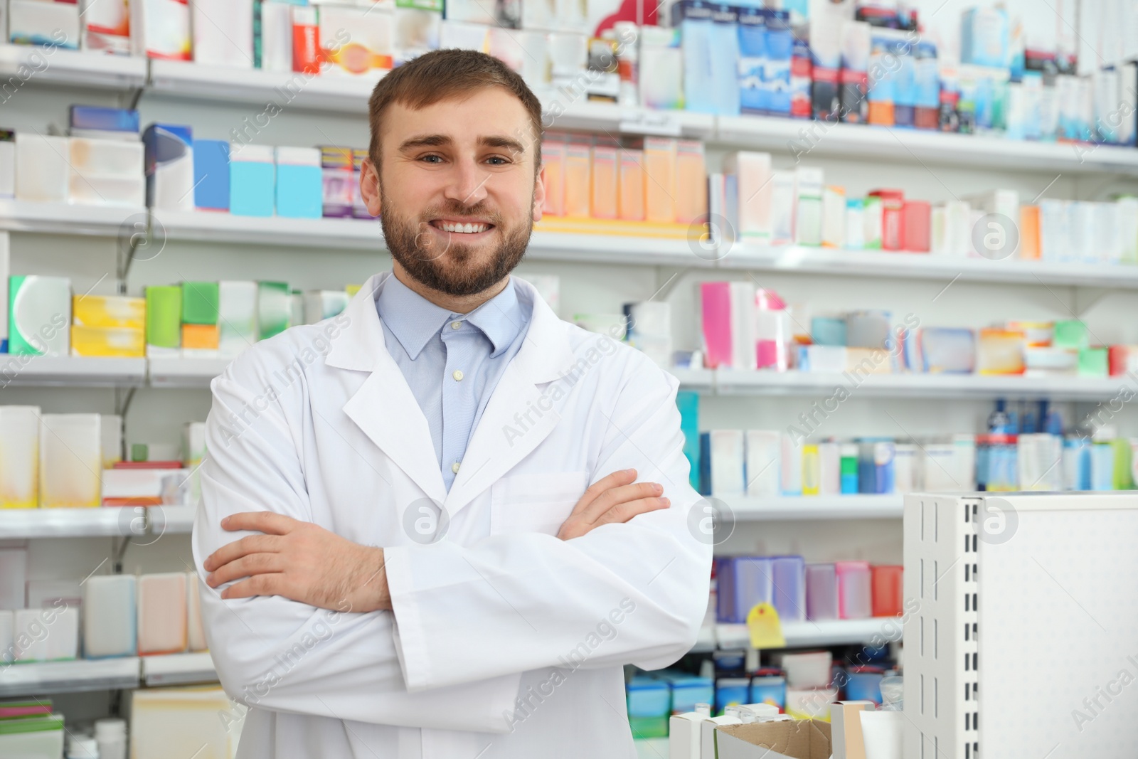 Image of Portrait of professional pharmacist in modern drugstore