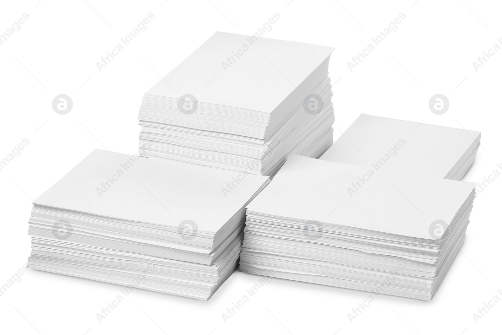 Photo of Stacks of paper sheets on white background