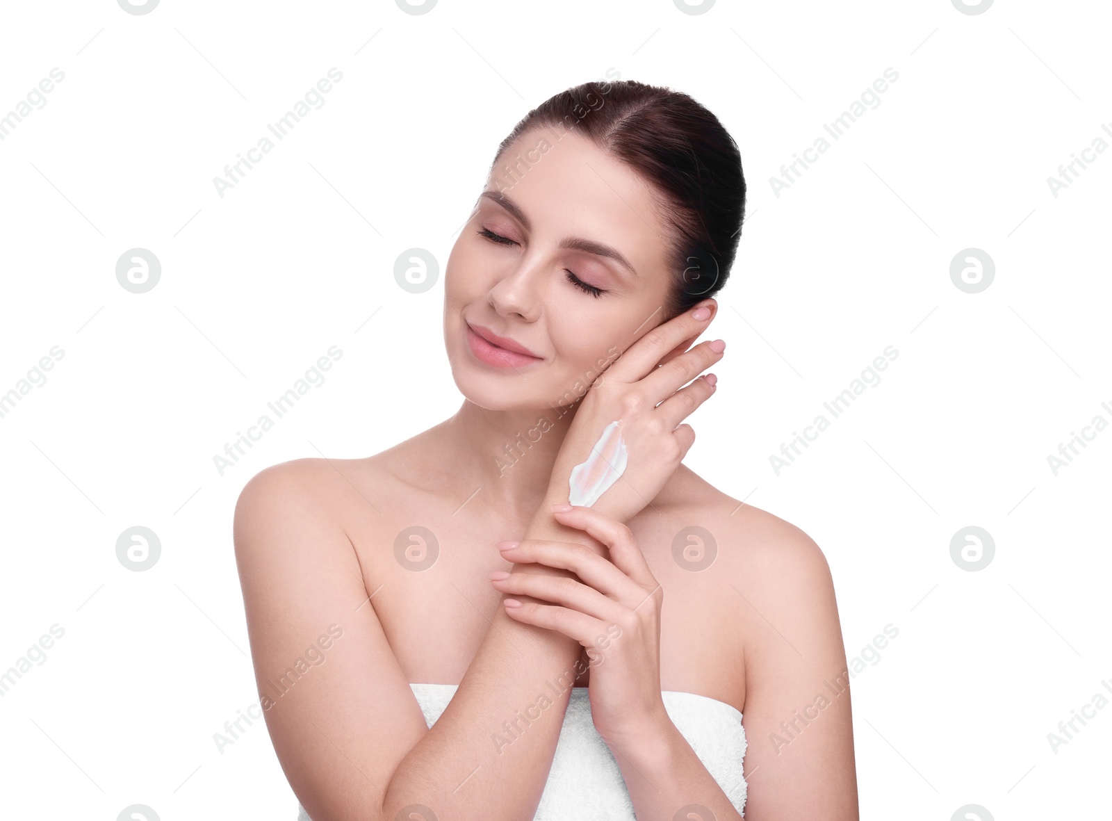 Photo of Beautiful woman with smear of body cream on her hand against white background