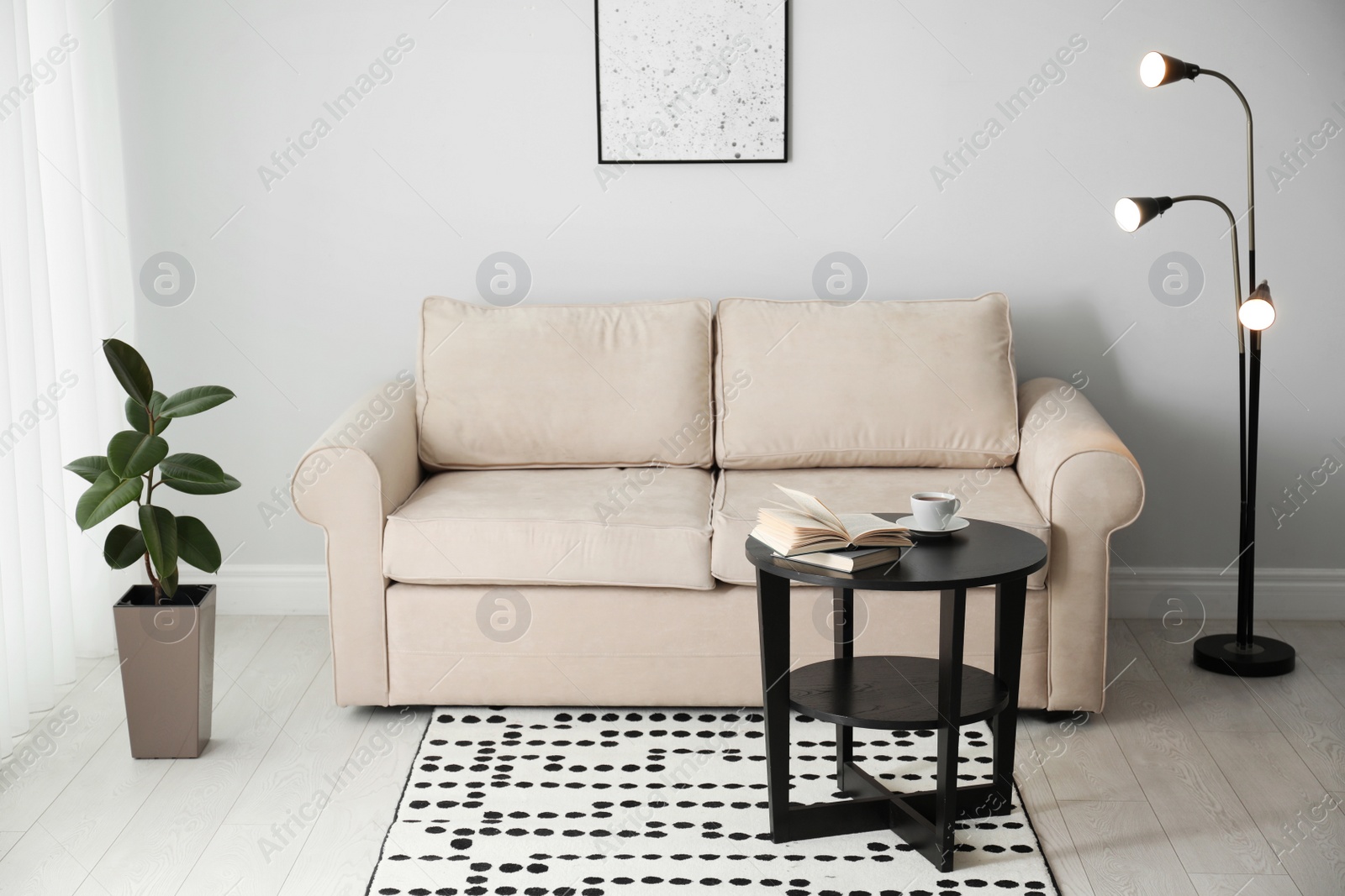 Photo of Modern comfortable sofa in stylish home interior