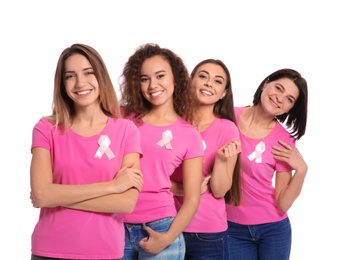 Photo of Group of women with silk ribbons on white background. Breast cancer awareness concept