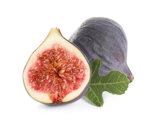 Photo of Whole and cut purple figs on white background