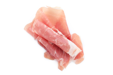 Slices of tasty prosciutto on white background, top view