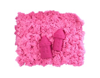 Castles made of kinetic sand on white background, top view