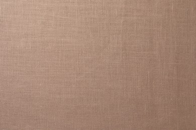 Texture of brown fabric as background, top view