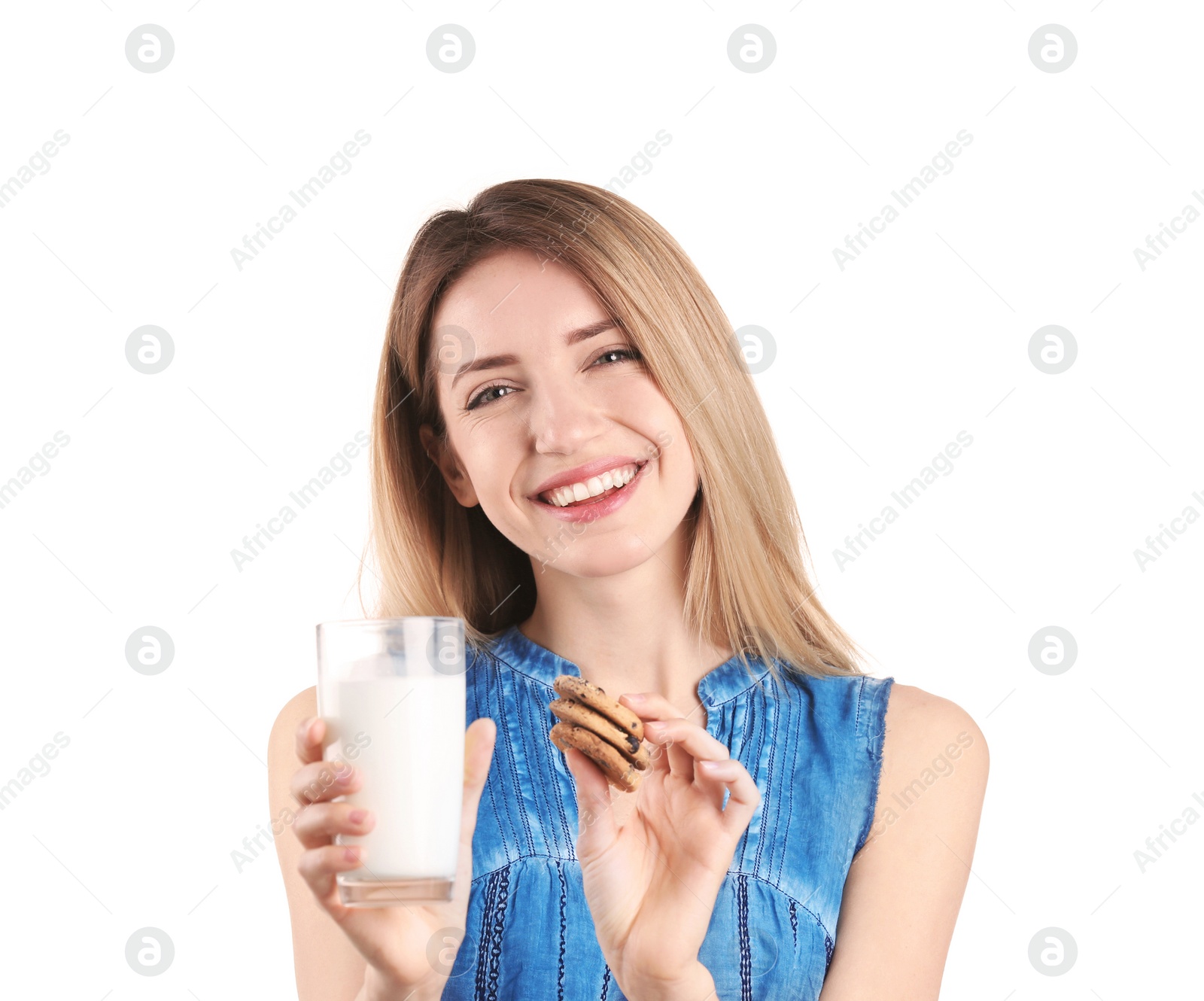 Photo of Beautiful young woman drinking milk with cookies on white background