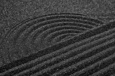 Closeup view of beautiful black sand. Zen and harmony