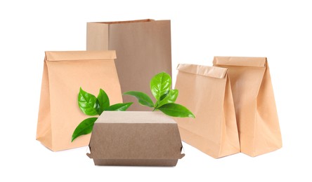 Image of Different containers and green fresh leaves on white background