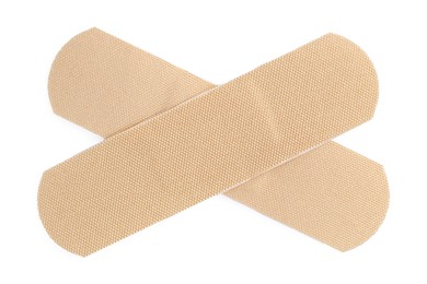 Photo of Medical adhesive bandages isolated on white, top view