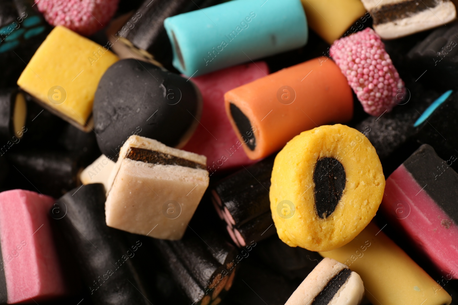 Photo of Many different liquorice candies as background, closeup