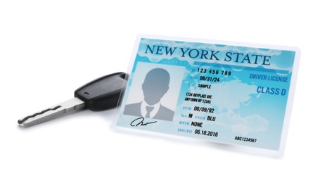 American driving license and car key on white background