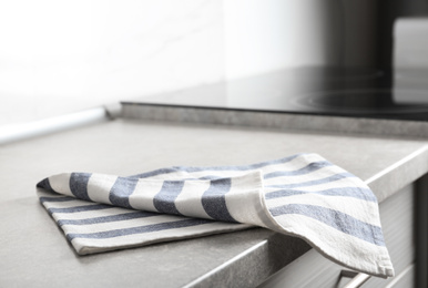 Striped cotton towel on countertop in kitchen