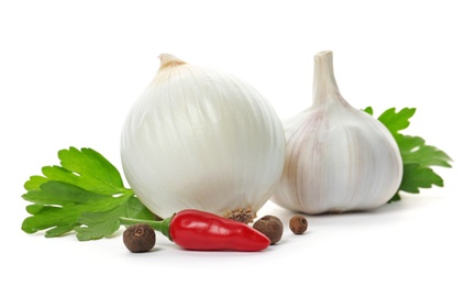 Photo of Garlic, onion, chili pepper, allspice and parsley on white background