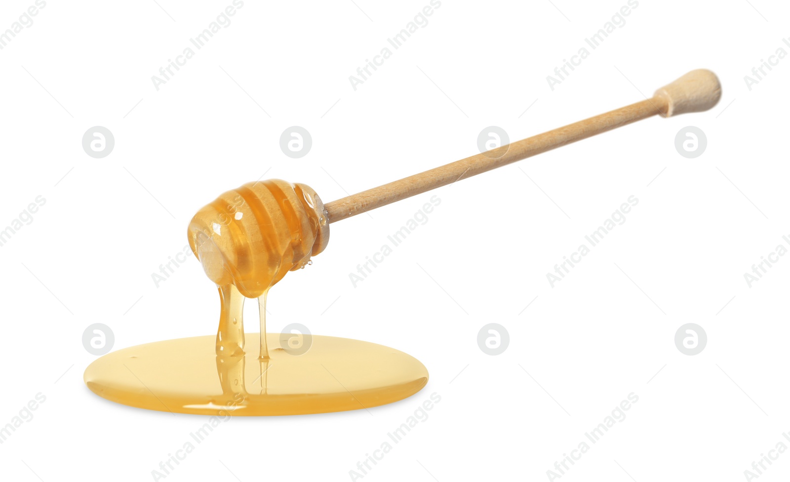 Photo of Natural honey dripping from dipper on white background