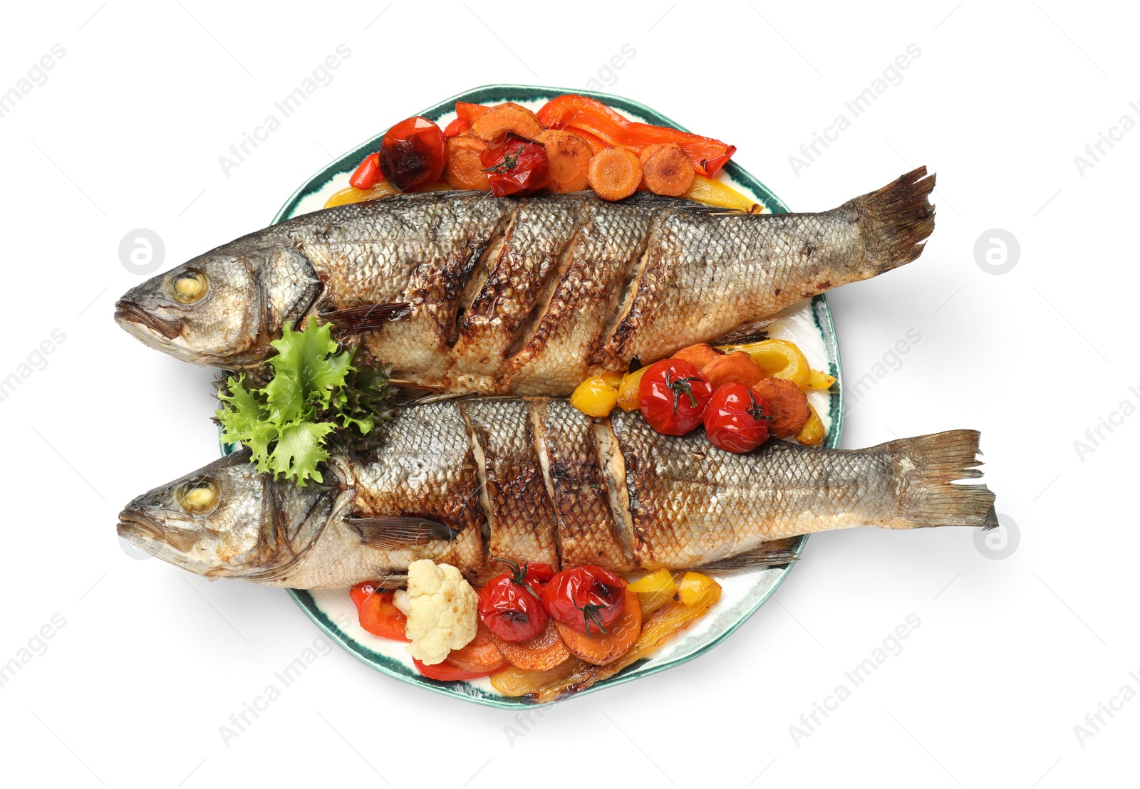 Photo of Plate with delicious baked sea bass fish and vegetables on white background, top view