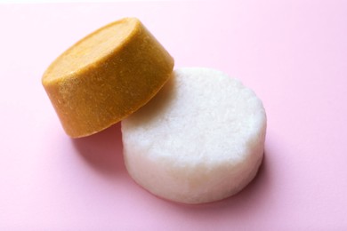 Photo of Solid shampoo bars on pink background. Hair care