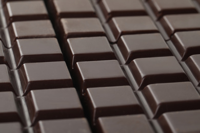 Photo of Delicious dark chocolate as background, closeup view