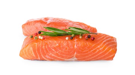 Photo of Pieces of fresh raw salmon and spices on white background