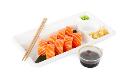 Food delivery. Delicious sushi rolls with soy sauce, ginger, wasabi and chopsticks in plastic container isolated on white