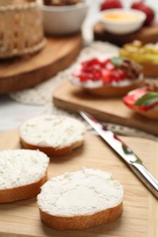 Photo of Delicious bruschettas with ricotta cheese on table, closeup