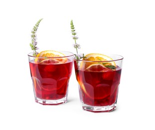Glasses of delicious refreshing sangria isolated on white