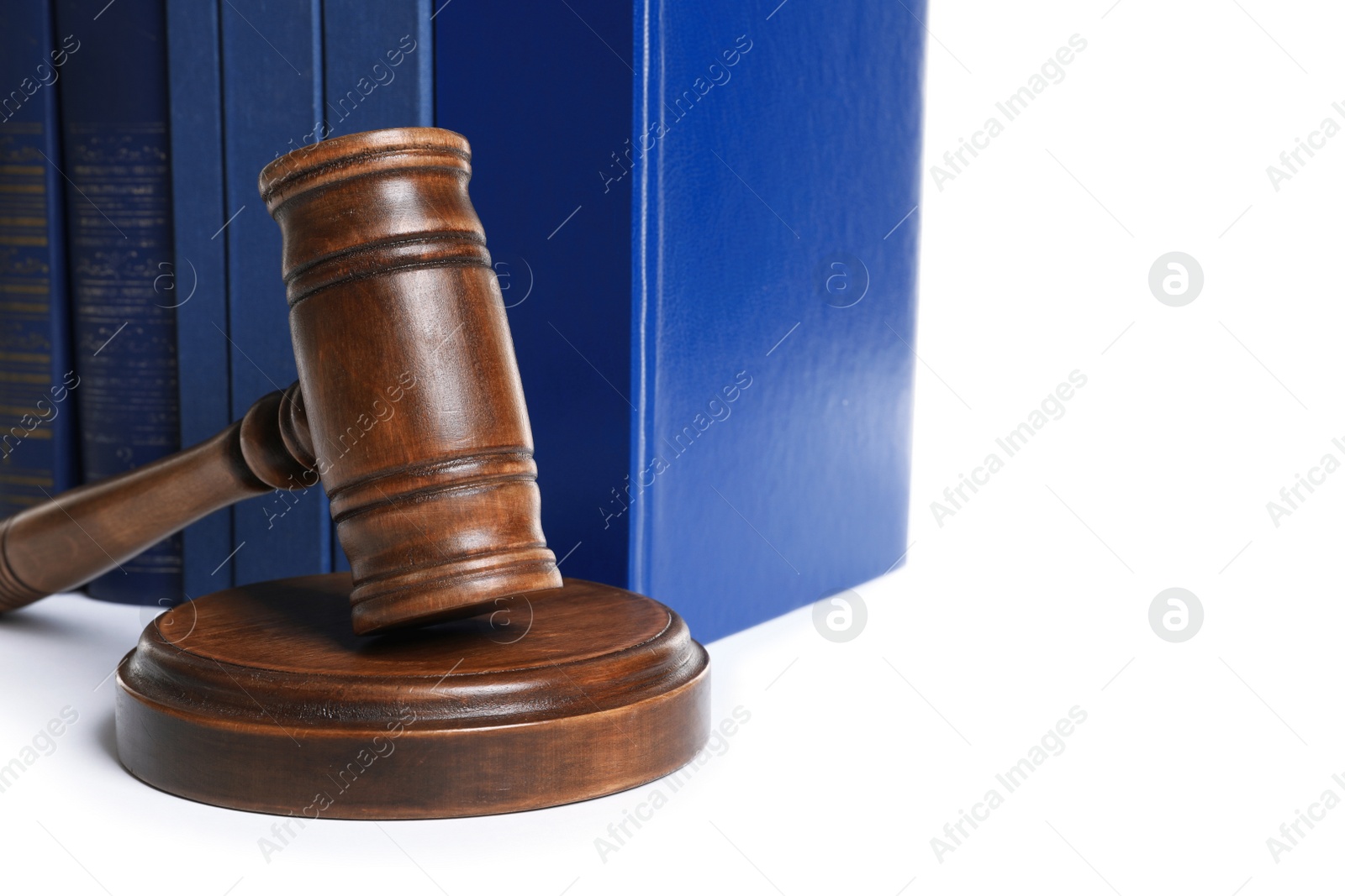 Photo of Wooden gavel and books on white background. Law concept