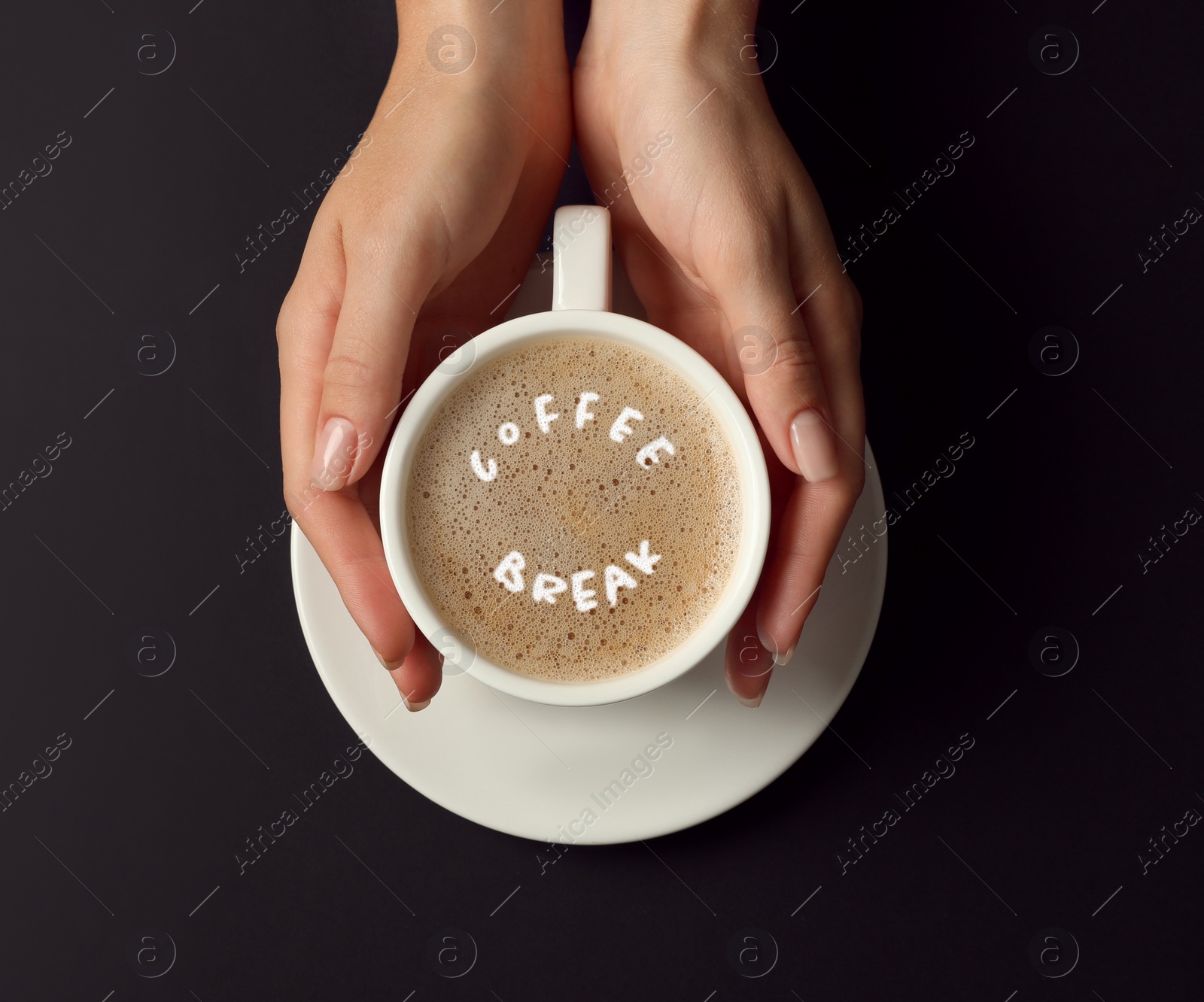 Image of Coffee Break. Woman with cup of americano on black background, top view