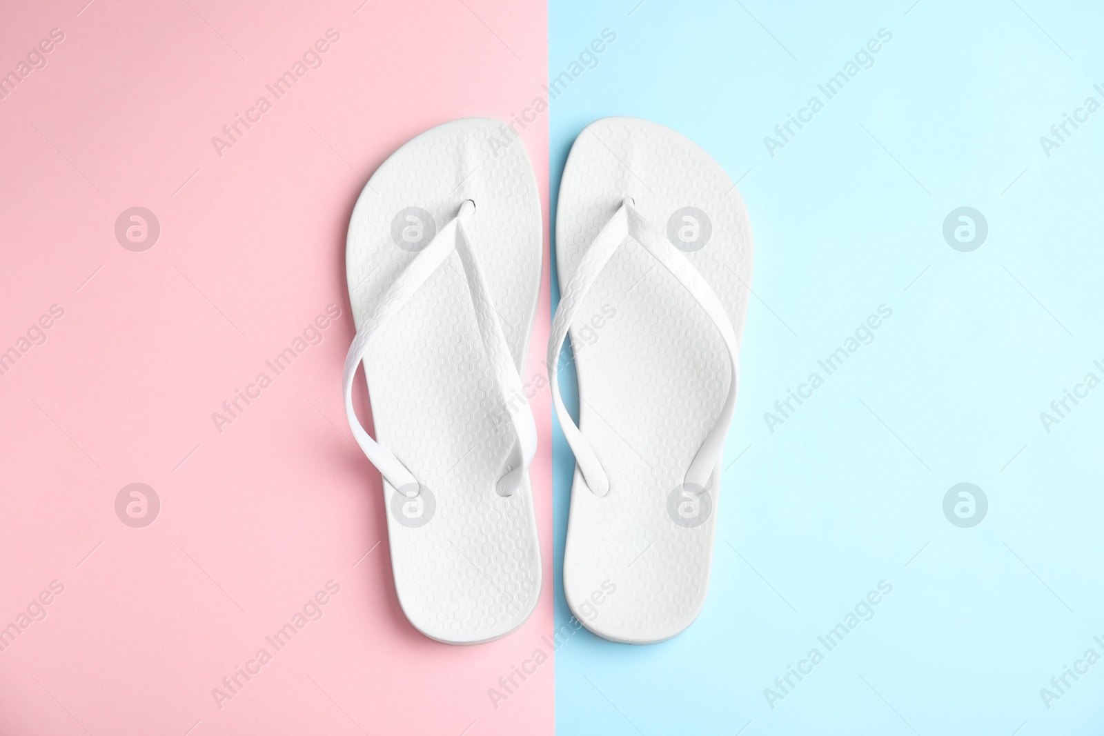 Photo of Flat lay composition with flip flops on color background. Beach objects